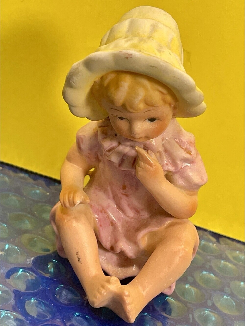 Little Girl Dressed In Pink With Yellow Bonnet Figurine